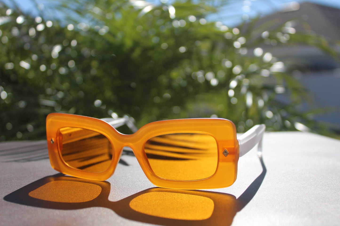 “Fashion accessory: Cloud Jelly Sun sunglasses with bold, youthful design and radiant Orange tone”
